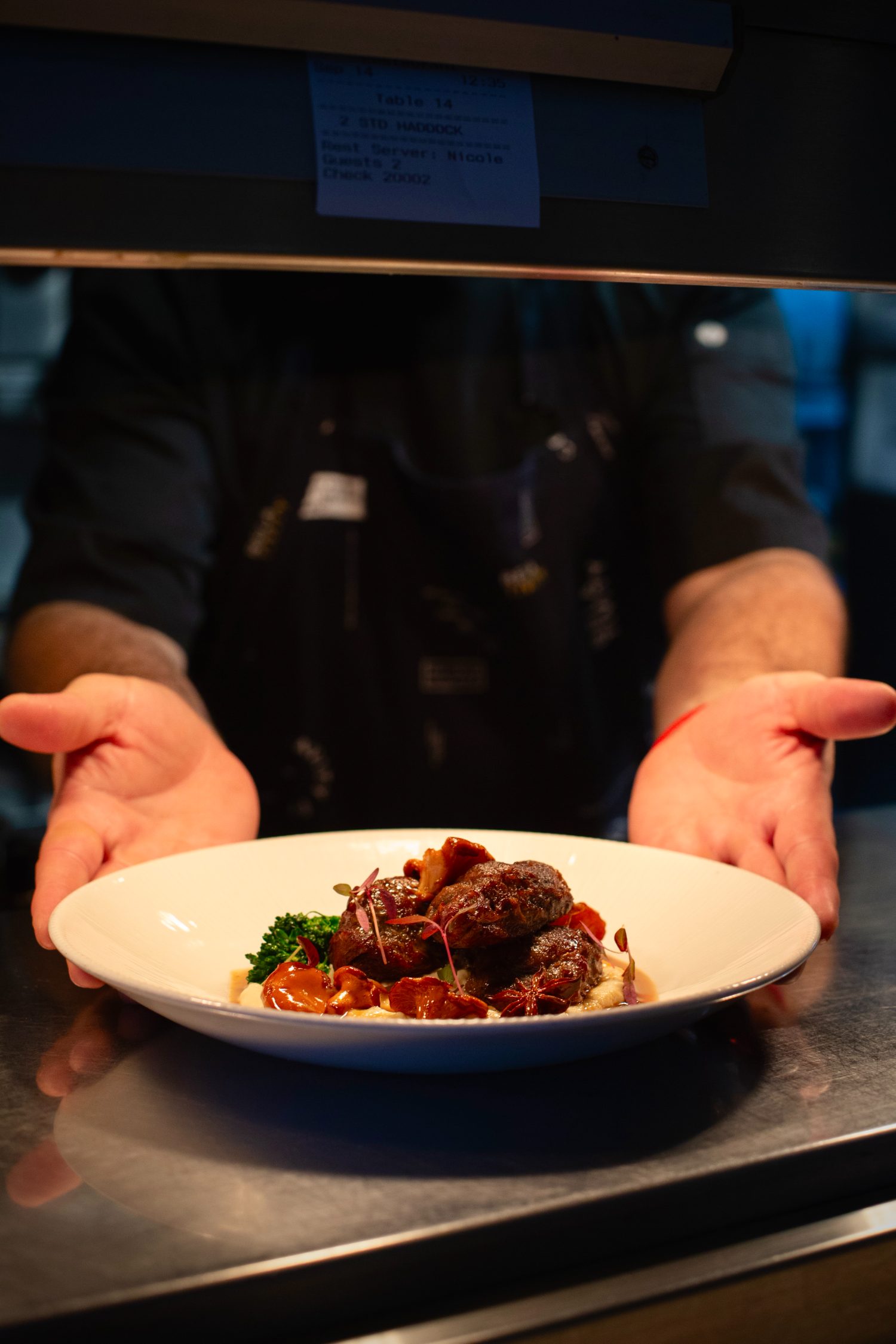 Braised beef cheeks, chanterelles, at the pass