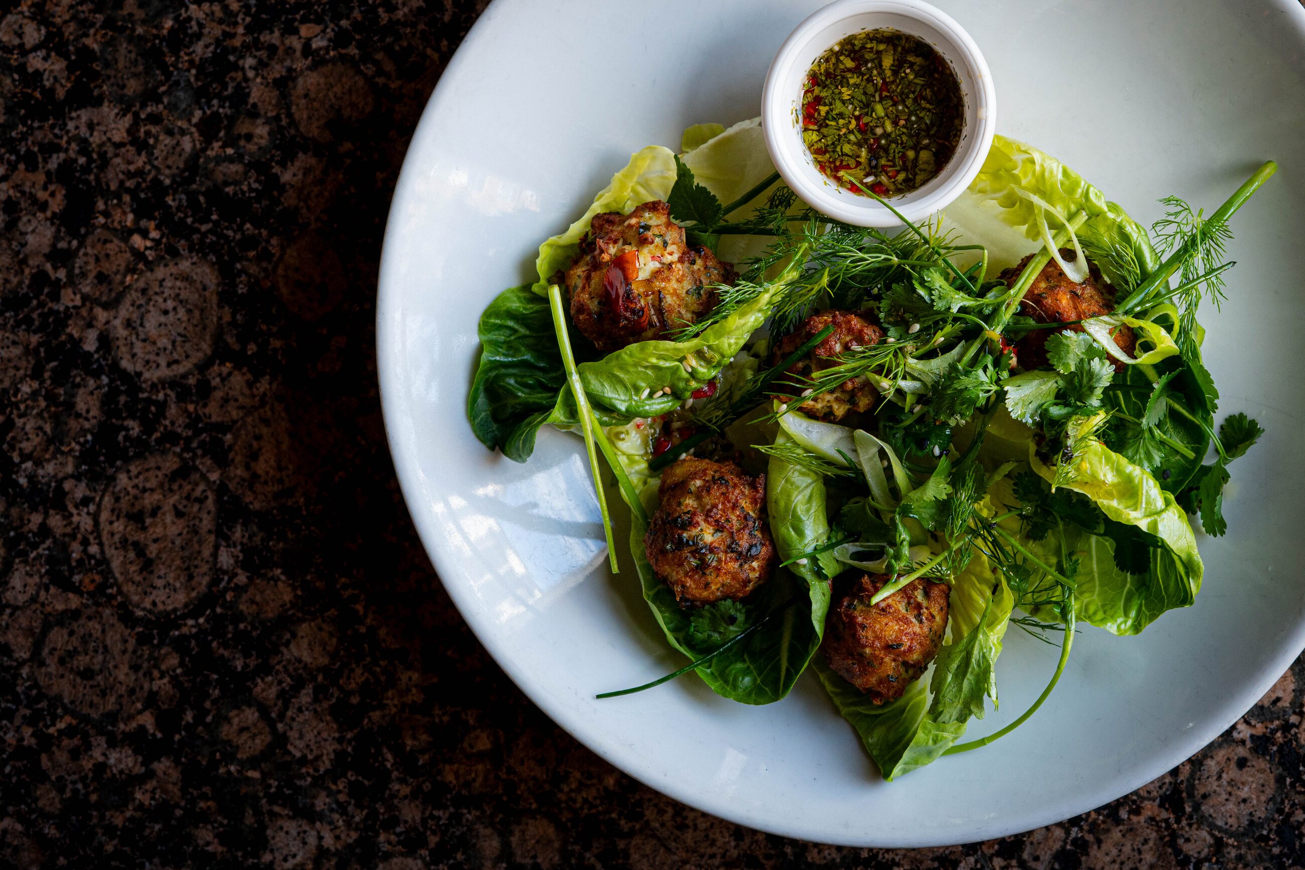 Herb-crusted fish parcels in lettuce cups
