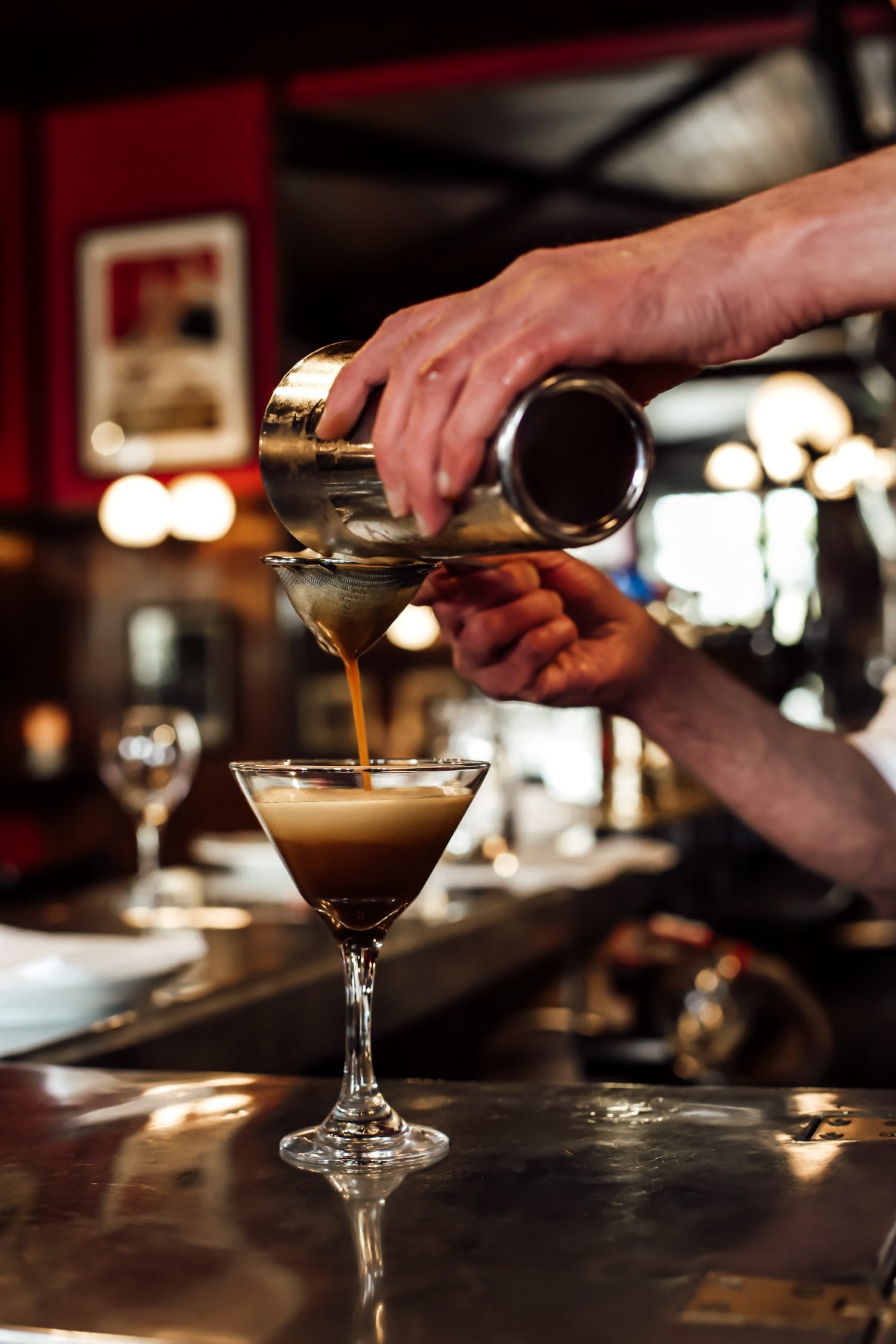 An espresso martini poured at the bar